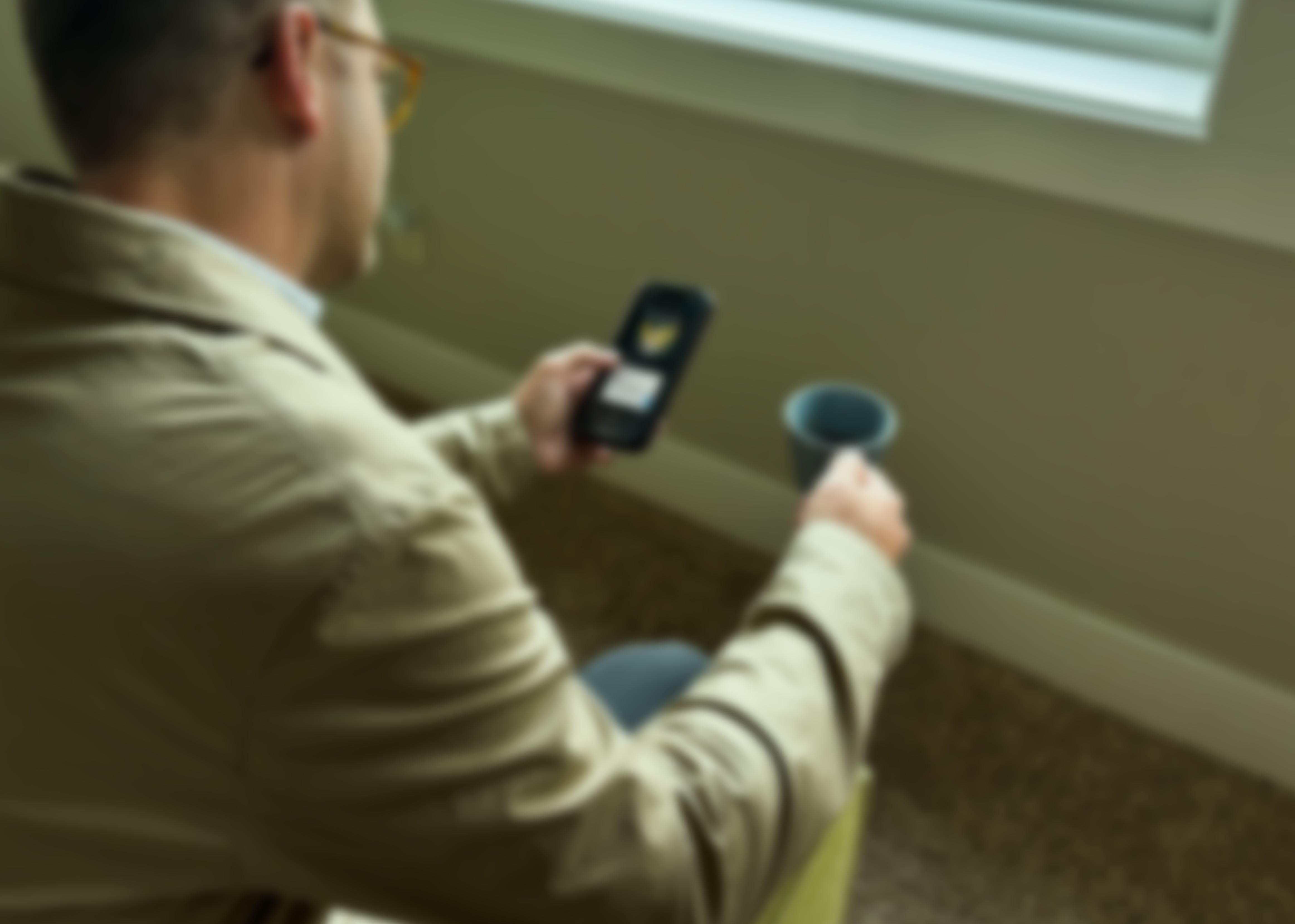 Man focused on phone scrolling